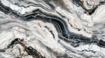 The polished surface of this marble floor reveals a stunning array of intricate details from delicate lines of grey to bold dramatic swirls of black and white photo