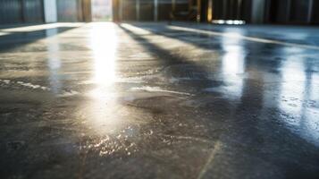 Light reflects off the smooth and shiny surface of a newly poured concrete floor exuding a modern and industrial feel photo