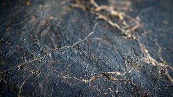 A heavily textured granite backsplash with small cracks and divots evoking a sense of ruggedness and durability photo