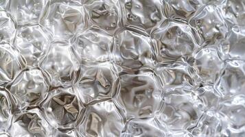A macro shot of the bubble wrap reveals the intricate patterns created by the overlapping bubbles. Each bubble creates a small shadow behind it adding depth and dimension to the texture photo