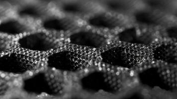 Tiny raised bumps can be felt tered across the graphene sheet providing another layer of texture and complexity to its appearance photo