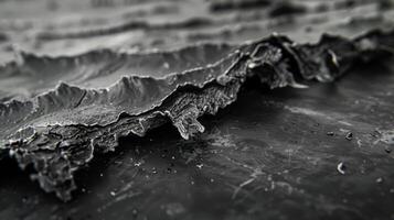 The edges of the graphene sheet are jagged and raw revealing the fractured nature of this incredibly thin yet strong material photo