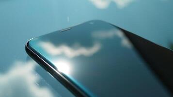 The sleek glossy OLED screen glistens in the sun its surface appearing flawless and reminiscent of liquid glass photo