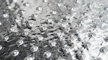 Tiny raised dots cover this embossed aluminum reminiscent of a bubble wrap pattern but with a metallic shine photo