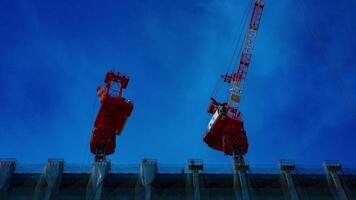 A time lapse of moving cranes at the under construction in Tokyo closeup video