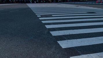 A timelapse of people at the crossing in Shibuya Tokyo daytime slow shutter zoom video