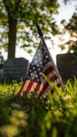 A solemn image of a soldier grave marked by a neatly placed American flag, symbolizing honor and remembrance on Memorial Day. photo