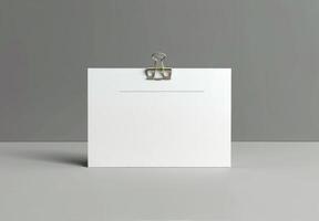 Blank White Paper Clip Mockup On Grey Background photo