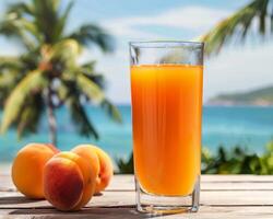 Peach Juice Drink on a Beach Table photo