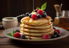 Fluffy Buttermilk Pancakes With Fresh Berries and Syrup photo