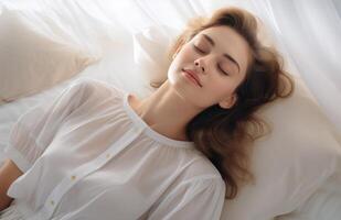 Woman Sleeping in Bed With White Bedding and Sheer Curtains photo