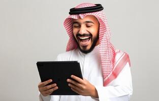 Happy Man in Traditional Clothing Using a Tablet Device photo