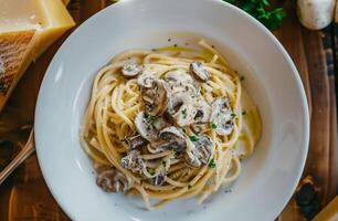 A Plate of Creamy Mushroom Spaghetti With Basil and Parmesan photo