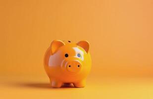 Yellow Piggy Bank on Orange Background photo