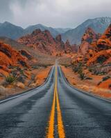 Empty Road Leading Through Red Rock Canyon National Conservation Area photo