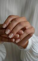 Closeup of Hands With Natural Nail Polish photo