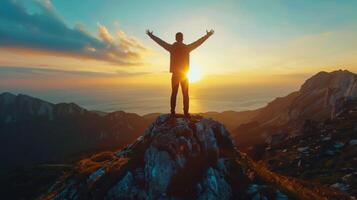 Silhouette Of Person Celebrating Sunrise Over Mountain Range With Hot Air Balloon photo