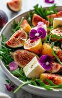 Fresh Fig, Peach, and Brie Salad With Edible Flowers photo