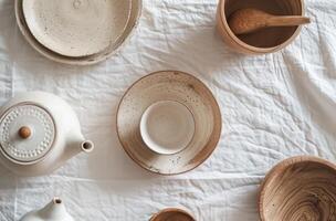 Table With White Dishes and Wooden Spoons photo