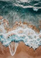 Aerial View of Ocean Waves and Sand photo