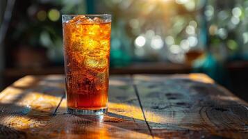Glass of Soda on Wooden Table photo