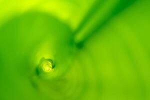 The rolled banana leaf, green background photo