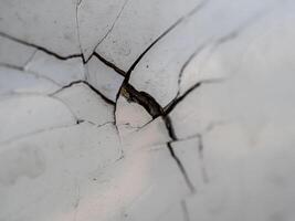 Extreme dents and Paint cracks are dislodged from parts of the accident car photo
