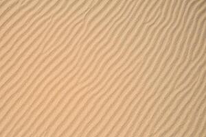 Beholding the Beauty of a Beach with Natural Motif Sands from Above, a Serene Coastal Vista photo