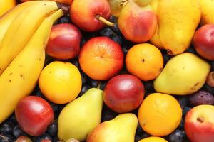 Beautiful Tropical Fruits Background A Luscious Display of Nature's Bounty, Featuring an Abundance of Colorful and Exotic Fruits Against a Vibrant and Refreshing Backdrop photo
