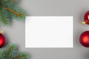 Beautiful Mockup White Card with Christmas Ornaments, A Festive Touch for Your Holiday Greetings photo