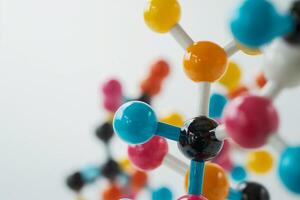 Closeup of colorful molecule structures on a white background, empty space for text photo