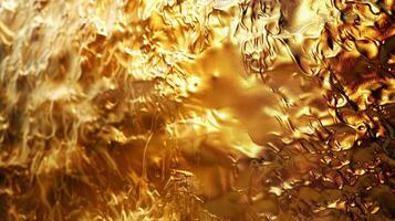 A shimmering gold metal background with a hammered texture, close up for luxury design photo