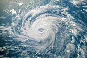 Satellite image of a massive hurricane approaching a densely populated coast photo