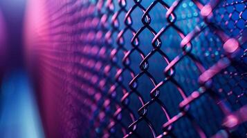 Detailed shot of a metal mesh with a gradient blue to purple background photo