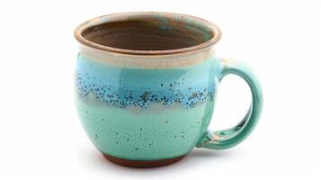 Handcrafted ceramic coffee mug in pastel blue and green, isolated on a white background photo