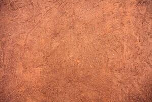 Red Sandy Surface Imprinted with Shoe Tracks, Texture Background photo
