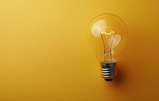 Light Bulb on Yellow Surface photo