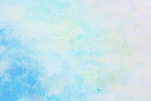 cloudy sky with gradient pastel color nature abstract background on the texture of the watercolor painting paper photo
