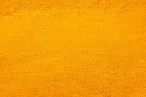 Vibrant Turmeric Powder, A Captivating Background for Culinary and Wellness Concepts photo