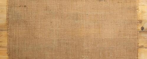 Burlap Fabric Texture on Wooden Surface, Rustic Background Concept photo