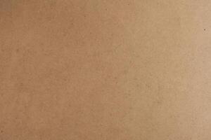 Horizontal Kraft Paper Texture Sheet on Cardboard Brown Background photo
