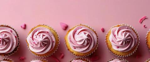Cupcakes With Pink Frosting and Red Sprinkles on a Pink Plate photo
