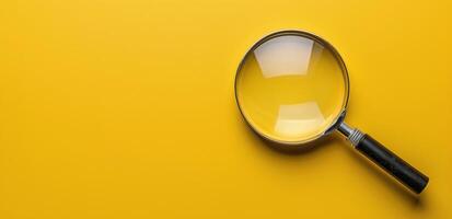 Magnifying Glass on a Yellow Background photo