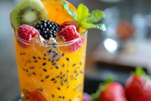 Colorful Drink With Oranges and Raspberries in a Glass photo