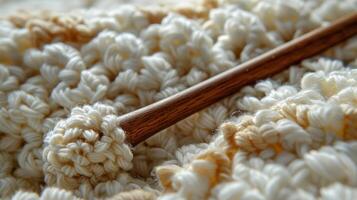 Close Up of Crocheted Dishcloth With Wooden Spoon photo