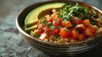 Bowl of Couscous With Avocado, Tomatoes, and Cilantro photo