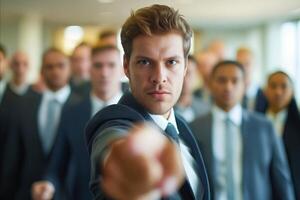 A man in a suit is pointing at something photo