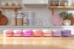 Assorted Macarons in a Modern Kitchen, Row of colorful macarons placed neatly on a wooden countertop, with a modern kitchen setting in the background. photo