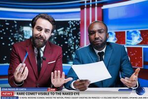 Night show hosts discuss astronomy event, presenting news about rare comet lighting night sky and captivating stargazers. Two newscaster broadcasting live reportage on visible star. photo