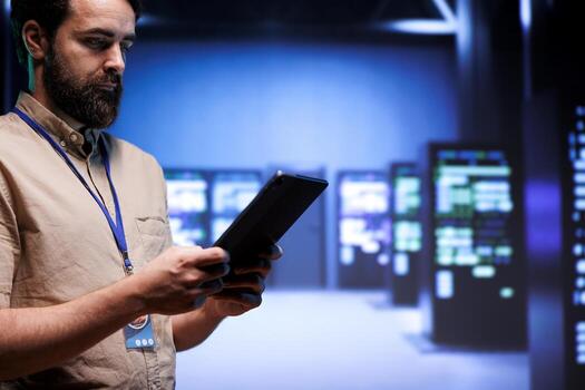 Adept system administrator doing maintenance on interlinked computers creating server network. Data storage service business using parallel computing to perform complex computing operations photo